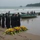 emotional funeral at beach